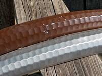 Wire wheeled fender next to old brown paint